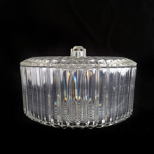 Load image into Gallery viewer, Clear faceted lucite plastic lidded vanity box nestled in a silver ormolu handled caddy. The silver-toned metal ormolu caddy has two handles and three ball feet. An excellent addition to your boudoir or bathroom vanity for powder or trinkets. In excellent vintage condition, free from chips. Measures 5 1/8 x 3 1/2 (not incl. handles)
