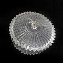 Load image into Gallery viewer, Clear faceted lucite plastic lidded vanity box nestled in a silver ormolu handled caddy. The silver-toned metal ormolu caddy has two handles and three ball feet. An excellent addition to your boudoir or bathroom vanity for powder or trinkets. In excellent vintage condition, free from chips. Measures 5 1/8 x 3 1/2 (not incl. handles)
