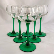 Load image into Gallery viewer, A vintage mod set of six elegant Luminarc emerald green stemmed wine glasses. Crafted by J.G. Durand Cristal d&#39;Arques, France, circa 1970s. We are loving the vibrancy of the stems that will add that perfect pop of colour to your barware...cheers!  In excellent  condition free from chips. Marked &quot;luminarc FRANCE&quot; on the bottom.  Measures 2 3/4 x 6 1/2 inches  Capacity 5 ounces   
