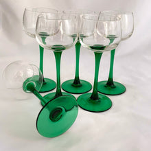 Load image into Gallery viewer, A vintage mod set of six elegant Luminarc emerald green stemmed wine glasses. Crafted by J.G. Durand Cristal d&#39;Arques, France, circa 1970s. We are loving the vibrancy of the stems that will add that perfect pop of colour to your barware...cheers!  In excellent  condition free from chips. Marked &quot;luminarc FRANCE&quot; on the bottom.  Measures 2 3/4 x 6 1/2 inches  Capacity 5 ounces   
