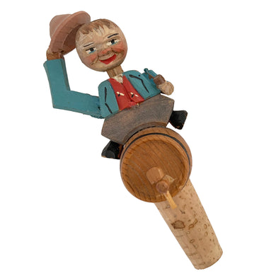 Vintage mid-century era novelty hand carved wood folk art man riding a beer keg bottle stopper. Designed to fit a standard bottle. Crafted by Arni, Italy, 1950s. The perfect addition to your barware!

In good condition.

Measures 5 1/2 inches