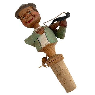 Vintage mid-century era novelty hand carved wood folk art violinist bottle stopper. Designed to fit a standard bottle. Crafted by Arni, Italy, 1950s. The perfect addition to your barware!

In good condition.

Measures 5 1/2 inches