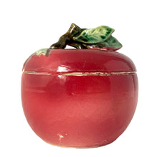 Load image into Gallery viewer, Vintage mid-century era hand painted majolica-style ceramic red apple lidded sugar bowl featuring figural branch finial in brown with green leaves. Crafted by Metroware, Japan, 1940s. This sweet apple is perfect for adding a touch of kitsch to your kitchen and table decor!

In excellent condition, no chips, cracks or repairs. There are a couple of small glaze misses. Age-related crazing.

Measures 3 7/8 x 4 inches
