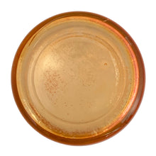 Load image into Gallery viewer, Bottom view of vintage Jeannette Glass marigold carnival glass powder jar showing iridescent surface
