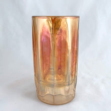 Load image into Gallery viewer, A vintage marigold carnival glass handled beer mug has great iridescence! Crafted by the Jeannette Glass Company, USA, circa 1920s/30s. Enjoy a cold one in this special piece of glass!  In excellent condition, free from chips/cracks.  Measures 3 x 5 1/2-inches tall  Capacity 10 ounces
