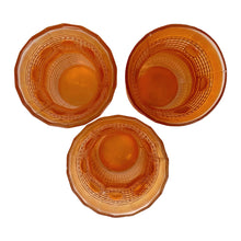 Load image into Gallery viewer, Vintage marigold carnival glass Maharajah corset-shaped shot glass. Crafted by Jain Glassworks, India, 1930s. The iridescence, pattern and shape are lovely on this rare piece of glass!

In excellent vintage condition, no chips.

Measures 1 7/8 x 2 3/4 inches
