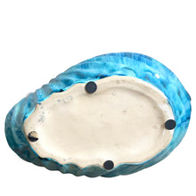 Load image into Gallery viewer, Bottom view of vintage nautilus shell planter showing organic ridged texture and blue glaze
