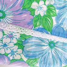 Load image into Gallery viewer, This is a gorgeous twin size 100% cotton flat sheet in the &quot;Martinique&quot; pattern in the pink/orange/green colourway with a lovely white eyelet detail at the turnover hem. Produced by Wabasso Canada, circa 1970s. This colourful mod flower power print brings so much fun and energy to your home decor!  In as found vintage condition. There is a Toonie-sized hole in the sheet. Original label present and worn.   Measures 78 x 94 inches

