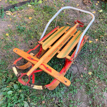 Load image into Gallery viewer, Classic vintage mid-century Mastercraft children&#39;s snow sled. The model is No. 570100. This sled features a steel frame with wood skis, deck and steering bar, metal backrest and mattress cushion. Crafted by Canadian Tire Corporation, Canada, 1960s. Bring back all the wonderful of snowy winter days with this beloved wee sled!

In as found vintage condition with wear to the entire piece commensurate with use and age. Original sticker present.
