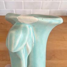 Load image into Gallery viewer, Beautiful vintage Art Deco matte aqua leaf topped handled vase. Crafted by McCoy Pottery, 1940s. This vase is must for any art pottery collector!

In as found vintage condition, area at the rim where glaze has come away, no chips/cracks/repairs. Maker&#39;s mark on the bottom.

Measures 5 1/4 x 9 1/4 inches
