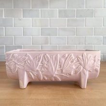 Load image into Gallery viewer, Vintage Art Deco matte pink Butterfly Line fernery. Crafted by Nelson McCoy Pottery, early 1940s. This rare piece is must for any McCoy art pottery collector!

In excellent condition, tiny flea bite on interior rim, no chips/cracks/repairs. Maker&#39;s mark.

Measures 8 1/2 x 4 x 3 3/8 inches
