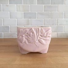 Load image into Gallery viewer, Vintage Art Deco matte pink Butterfly Line fernery. Crafted by Nelson McCoy Pottery, early 1940s. This rare piece is must for any McCoy art pottery collector!

In excellent condition, tiny flea bite on interior rim, no chips/cracks/repairs. Maker&#39;s mark.

Measures 8 1/2 x 4 x 3 3/8 inches
