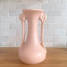 Load image into Gallery viewer, Beautiful vintage Art Deco matte pink leaf topped handled vase. Crafted by McCoy Pottery, 1940s. This vase is must for any art pottery collector!

In excellent vintage condition, no chips, no cracks, no repairs. Maker&#39;s mark on the bottom.

Measures 5 1/4 x 9 1/4 inches
