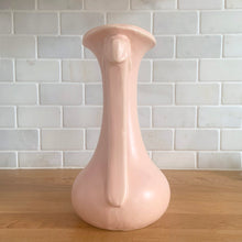 Load image into Gallery viewer, Beautiful vintage Art Deco matte pink leaf topped handled vase. Crafted by McCoy Pottery, 1940s. This vase is must for any art pottery collector!

In excellent vintage condition, no chips, no cracks, no repairs. Maker&#39;s mark on the bottom.

Measures 5 1/4 x 9 1/4 inches
