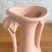 Load image into Gallery viewer, Beautiful vintage Art Deco matte pink leaf topped handled vase. Crafted by McCoy Pottery, 1940s. This vase is must for any art pottery collector!

In excellent vintage condition, no chips, no cracks, no repairs. Maker&#39;s mark on the bottom.

Measures 5 1/4 x 9 1/4 inches
