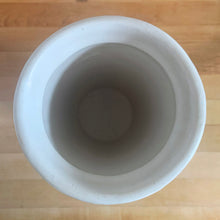 Load image into Gallery viewer, Vintage art deco matte white ceramic vase featuring repeating columns of stacked palm leaves. Crafted by Robinson Ransbottom Pottery Co., USA, 1930s. A beautiful piece to add to your art pottery collection!

In excellent condition, no chips/cracks/repairs. Typical manufacturing glaze pops. Unmarked.

Measures 6 1/8 x 10 inches
