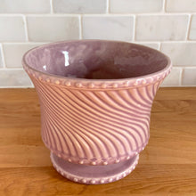Load image into Gallery viewer, Striking vintage gloss mauve swirl footed pedestal planter pot with hobnail details. Crafted by McCoy Pottery, 1962. This rare planter is must for any McCoy art pottery collector!

In excellent vintage condition, no chips or cracks. Maker's mark on the bottom.

Measures 6 x 5 inches
