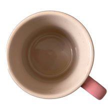 Load image into Gallery viewer, Retired Mauve Pink Le Creuset stoneware 14oz mug with iconic three-ring accent and cream beige interior. Top view.
