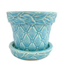 Load image into Gallery viewer, McCoy Tierra Cushion aqua planter, low-angle front view showing the depth of the embossed cushion pattern and the attached underplate
