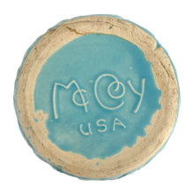 Load image into Gallery viewer, Base view of McCoy Tierra Cushion planter showing the embossed McCoy USA maker's mark in aqua glaze on unglazed stoneware rim, 1950
