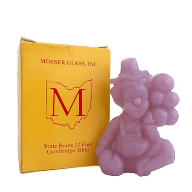 Vintage McGoo All the World Loves a Clown lavender slag glass figurine. Crafted by Mosser Glass, USA, 1981 - 1982. This adorable little collectible clown holds a bunch of balloons and has his name on his back...so cute!

In like new condition, in original box.

Measures 2 3/4 x 1 3/8 x 3 1/2 inches
