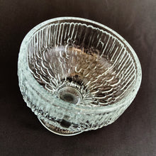 Load image into Gallery viewer, A unique set of six vintage clear pressed glass sherbet dishes that offer a nod to the Scandinavian art glass designers of the mid-century. These nicely weighted glacier style sherbets have a smooth texture of a melting wall of ice right down to their flared foot. Perfect for adding a mid mod touch to your desserts!  In excellent condition, free from chips/cracks.  Measures 3 3/4 x 3 1/2 inches  Capacity 10 ounces
