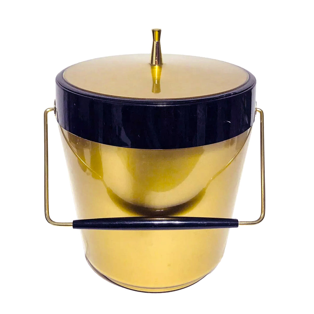 Super cool, vintage mid-century era metallic gold and black plastic ice bucket. Crafted by Westbend, USA, 1960s. Amp up the glam of your retro barware with this generous sized Mad Men style piece!

In as found vintage condition with chip to the edge of the lid. Not obvious against the black border of the bucket.

Measures 8 x 11 inches (without handle extended)