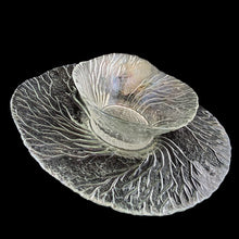 Load image into Gallery viewer, This vintage Metsa Forest clear glass serving plate and bowl set features a swaying pattern of tree branches. Designed by artisan Pertti Kallioinen. Crafted by Lasisepat Mantsala, Finland, 1970s. Perfect for serving your favourite chips and dip or snacks and dip. A lovely addition to your Finnish tableware collection!

In excellent condition, no chips.

Plate measures 11 1/4 inches, bowl measures 6 1/4 x 2 7/8 inches
