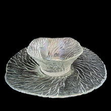 Load image into Gallery viewer, This vintage Metsa Forest clear glass serving plate and bowl set features a swaying pattern of tree branches. Designed by artisan Pertti Kallioinen. Crafted by Lasisepat Mantsala, Finland, 1970s. Perfect for serving your favourite chips and dip or snacks and dip. A lovely addition to your Finnish tableware collection!

In excellent condition, no chips.

Plate measures 11 1/4 inches, bowl measures 6 1/4 x 2 7/8 inches

