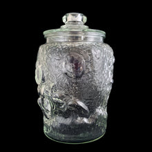 Load image into Gallery viewer, Super fun, vintage embossed Mickey Mouse clear glass lidded jar. Perfect for cookies and dry goods storage. Whether you&#39;re a collector or just a Walt Disney fan, this canister is a must-have!  In excellent condition, free from chips. Note there is a rough mold release on one side of the lid seam.  Measures 7 1/2 x 12 13/4 inches
