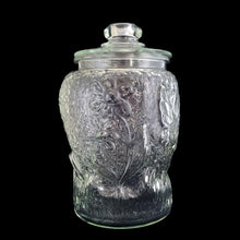 Load image into Gallery viewer, Super fun, vintage embossed Mickey Mouse clear glass lidded jar. Perfect for cookies and dry goods storage. Whether you&#39;re a collector or just a Walt Disney fan, this canister is a must-have!  In excellent condition, free from chips. Note there is a rough mold release on one side of the lid seam.  Measures 7 1/2 x 12 13/4 inches
