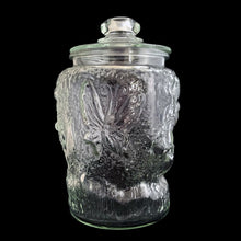 Load image into Gallery viewer, Super fun, vintage embossed Mickey Mouse clear glass lidded jar. Perfect for cookies and dry goods storage. Whether you&#39;re a collector or just a Walt Disney fan, this canister is a must-have!  In excellent condition, free from chips. Note there is a rough mold release on one side of the lid seam.  Measures 7 1/2 x 12 13/4 inches
