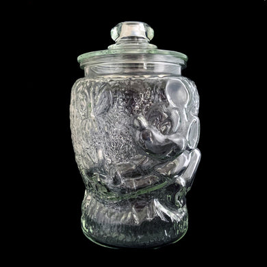 Super fun, vintage embossed Mickey Mouse clear glass lidded jar. Perfect for cookies and dry goods storage. Whether you're a collector or just a Walt Disney fan, this Libbey-made canister is a must-have!

In excellent condition, free from chips. Note there is a rough mold release on one side of the lid seam.

Measures 7 1/2 x 12 3/4 inches