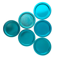 Load image into Gallery viewer, Overhead view of turquoise aluminum coaster showing raised edge detail and vibrant mid-century modern color finish
