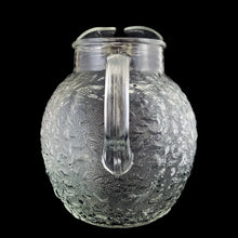 Load image into Gallery viewer, Vintage clear Miliano ice lip glass pitcher features a textured surface and ribbed handle. Crafted by Anchor Hocking, between 1960-1969. A true classic!


In excellent condition, no chips/cracks.

Measures 7 x 8 inches

Capacity 96 ounces
