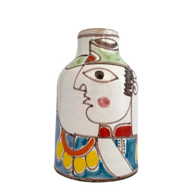 Vintage Giovanni de Simone art pottery bottle featuring a Picasso-like style colourful portrait of a gun-toting military man. Crafted by de Simone Pottery, Italy, 1960s. Highly collectible, this charming piece will make a wonderful addition to your home's decor and pottery collection!

Excellent condition, no chips, cracks or repairs. Signed on the bottom DESIMONE ITALY with numbers 24 and 205

Measures 3 1/2 x 5 1/2 inches