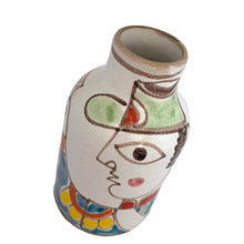 Load image into Gallery viewer, Vintage Giovanni de Simone art pottery bottle featuring a Picasso-like style colourful portrait of a gun-toting military man. Crafted by de Simone Pottery, Italy, 1960s. Highly collectible, this charming piece will make a wonderful addition to your home&#39;s decor and pottery collection!

Excellent condition, no chips, cracks or repairs. Signed on the bottom DESIMONE ITALY with numbers 24 and 205

Measures 3 1/2 x 5 1/2 inches
