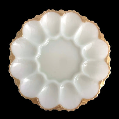 This lovely vintage pressed milk glass serving platter features a scalloped rim finished in peach lustre, accommodates 12 deviled eggs, plus the middle is perfect for a small bowl or salt/pepper shakers and the underside has an highly detailed design. Perfect for serving oysters on the half shell with your fave sauce in a small bowl in the middle....just set it on top of a tray or bowl of ice. In excellent condition, no chips. Crafted by Anchor Hocking, USA, circa 1950s. Measures 10 x 1 1/4 inches