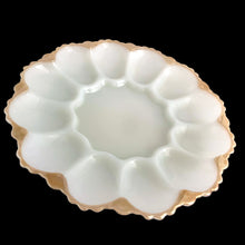 Load image into Gallery viewer, This lovely vintage pressed milk glass serving platter features a scalloped rim finished in peach lustre, accommodates 12 deviled eggs, plus the middle is perfect for a small bowl or salt/pepper shakers and the underside has an highly detailed design. Perfect for serving oysters on the half shell with your fave sauce in a small bowl in the middle....just set it on top of a tray or bowl of ice. In excellent condition, no chips. Crafted by Anchor Hocking, USA, circa 1950s. Measures 10 x 1 1/4 inches
