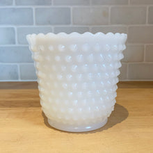 Load image into Gallery viewer, This beautiful, simple and elegant vintage milk glass planter features a hobnail design with a lovely scalloped edge. Produced by the Anchor Hocking Glass Company, circa 1960s. This planter is the perfect vessel for greenery, flowering plants or even repurse as a pen or paintbrush holder. Ideal cottage, shabby chic or wedding decor. You can&#39;t go wrong with this classic piece!  In excellent condition, no chips or cracks. Unmarked  Measures 5 3/4 x 5 1/8 inches
