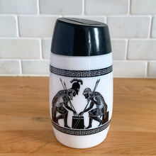 Load image into Gallery viewer, Classic vintage milk glass sugar dispenser, decorated with black Grecian soldiers bordered by Greek key bands, topped with a black flip top plastic lid. Crafted by Dominion Glass Canada, circa 1970s. Glass is in excellent condition, free from chips/cracks. Measures 2 3/4 x 5 1/2 inches
