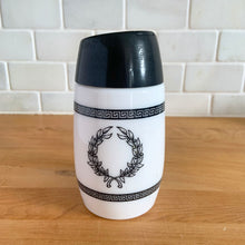 Load image into Gallery viewer, Classic vintage milk glass sugar dispenser, decorated with black Grecian soldiers bordered by Greek key bands, topped with a black flip top plastic lid. Crafted by Dominion Glass Canada, circa 1970s. Glass is in excellent condition, free from chips/cracks. Measures 2 3/4 x 5 1/2 inches

