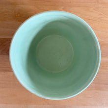 Load image into Gallery viewer, Vintage mint green embossed bows ceramic jardiniere planter, No. 287. Crafted by Robinson Ransbottom Pottery Co., 1940s. A beautiful piece to fill with your favourite houseplant and add to your art pottery collection!

In excellent vintage condition, no chips/cracks/repairs. Typical manufacturers glaze pops. Maker&#39;s mark.

Measures 6 x 4 inches
