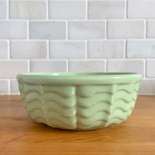 Load image into Gallery viewer, Vintage mint green ceramic mixing bowl 308, with an exterior pattern of horizontal waves. Crafted by Robinson Ransbottom Pottery Co., USA, 1960s. A beautiful piece to add to your art pottery collection!

In excellent condition, no chips/cracks/repairs, manufacturer&#39;s glaze pops. Maker&#39;s marks, number 308.

Measures 6 5/8 x 2 3/8 inches
