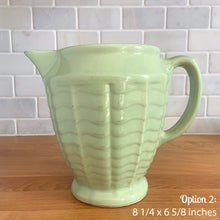 Load image into Gallery viewer, Vintage glossy mint green ceramic pitcher 308 which has an exterior pattern of horizontal waves. Crafted by Robinson Ransbottom Pottery Co., USA, 1930s. A lovely piece to add to your art pottery tableware collection which can be used as intended or fill with flowers!

In as found vintage condition, small chip to the foot, no cracks/repairs. Maker&#39;s marks.

Option 2: measures 8 1/4 x 6 5/8 inches (incl. handle/spout)
