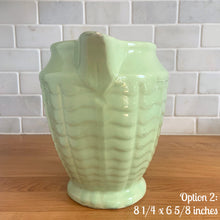 Load image into Gallery viewer, Vintage glossy mint green ceramic pitcher 308 which has an exterior pattern of horizontal waves. Crafted by Robinson Ransbottom Pottery Co., USA, 1930s. A lovely piece to add to your art pottery tableware collection which can be used as intended or fill with flowers!

In as found vintage condition, small chip to the foot, no cracks/repairs. Maker&#39;s marks.

Option 2: measures 8 1/4 x 6 5/8 inches (incl. handle/spout)
