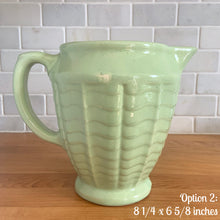 Load image into Gallery viewer, Vintage glossy mint green ceramic pitcher 308 which has an exterior pattern of horizontal waves. Crafted by Robinson Ransbottom Pottery Co., USA, 1930s. A lovely piece to add to your art pottery tableware collection which can be used as intended or fill with flowers!

In as found vintage condition, small chip to the foot, no cracks/repairs. Maker&#39;s marks.

Option 2: measures 8 1/4 x 6 5/8 inches (incl. handle/spout)
