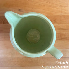 Load image into Gallery viewer, Vintage glossy mint green ceramic pitcher 308 which has an exterior pattern of horizontal waves. Crafted by Robinson Ransbottom Pottery Co., USA, 1930s. A lovely piece to add to your art pottery tableware collection which can be used as intended or fill with flowers!

In as found vintage condition, small chip to the foot, no cracks/repairs. Maker&#39;s marks.

Option 2: measures 8 1/4 x 6 5/8 inches (incl. handle/spout)
