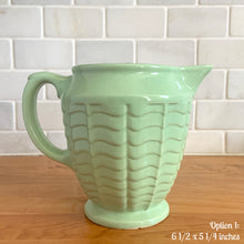 Load image into Gallery viewer, Vintage glossy mint green ceramic pitcher 308 which has an exterior pattern of horizontal waves. Crafted by Robinson Ransbottom Pottery Co., USA, 1930s. A lovely piece to add to your art pottery tableware collection which can be used as intended or fill with flowers!

In as found vintage condition, small chip to the foot, no cracks/repairs. Maker&#39;s marks.

Option 1: measures 6 1/2 x 5 1/4 inches (incl. handle/spout)

