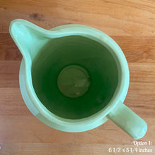 Load image into Gallery viewer, Vintage glossy mint green ceramic pitcher 308 which has an exterior pattern of horizontal waves. Crafted by Robinson Ransbottom Pottery Co., USA, 1930s. A lovely piece to add to your art pottery tableware collection which can be used as intended or fill with flowers!

In as found vintage condition, small chip to the foot, no cracks/repairs. Maker&#39;s marks.

Option 1: measures 6 1/2 x 5 1/4 inches (incl. handle/spout)
